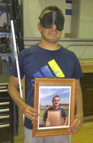 Picture frame shows a photo of Andy holding his picture frame