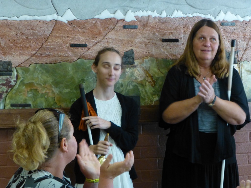 a young woman rings her Freedom Bell enthusiastically