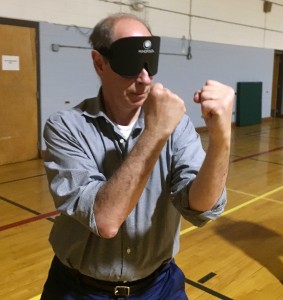 Man with fists in front of his face in defensive stance