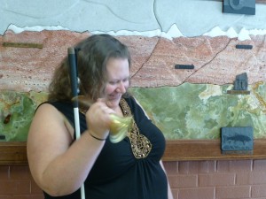 Woman rings her bell with a grin