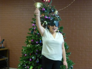 young woman rings her bell with a smile