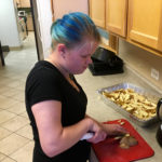 Vika slicing potatoes