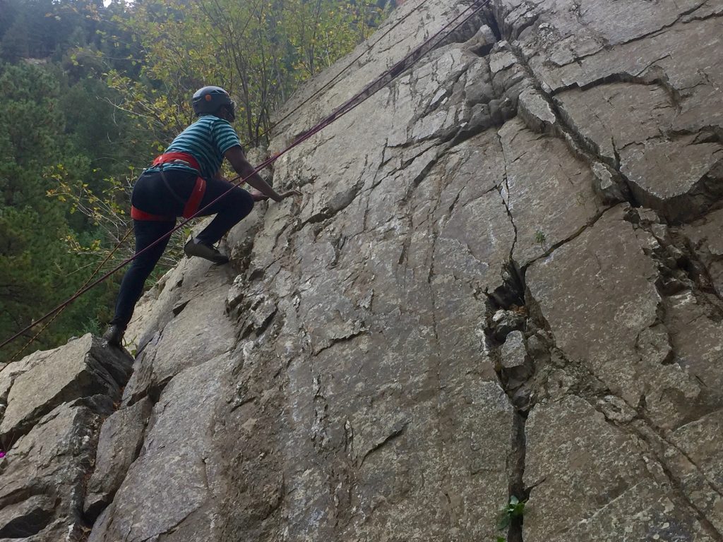 Christopher showing really good technique rock climbing