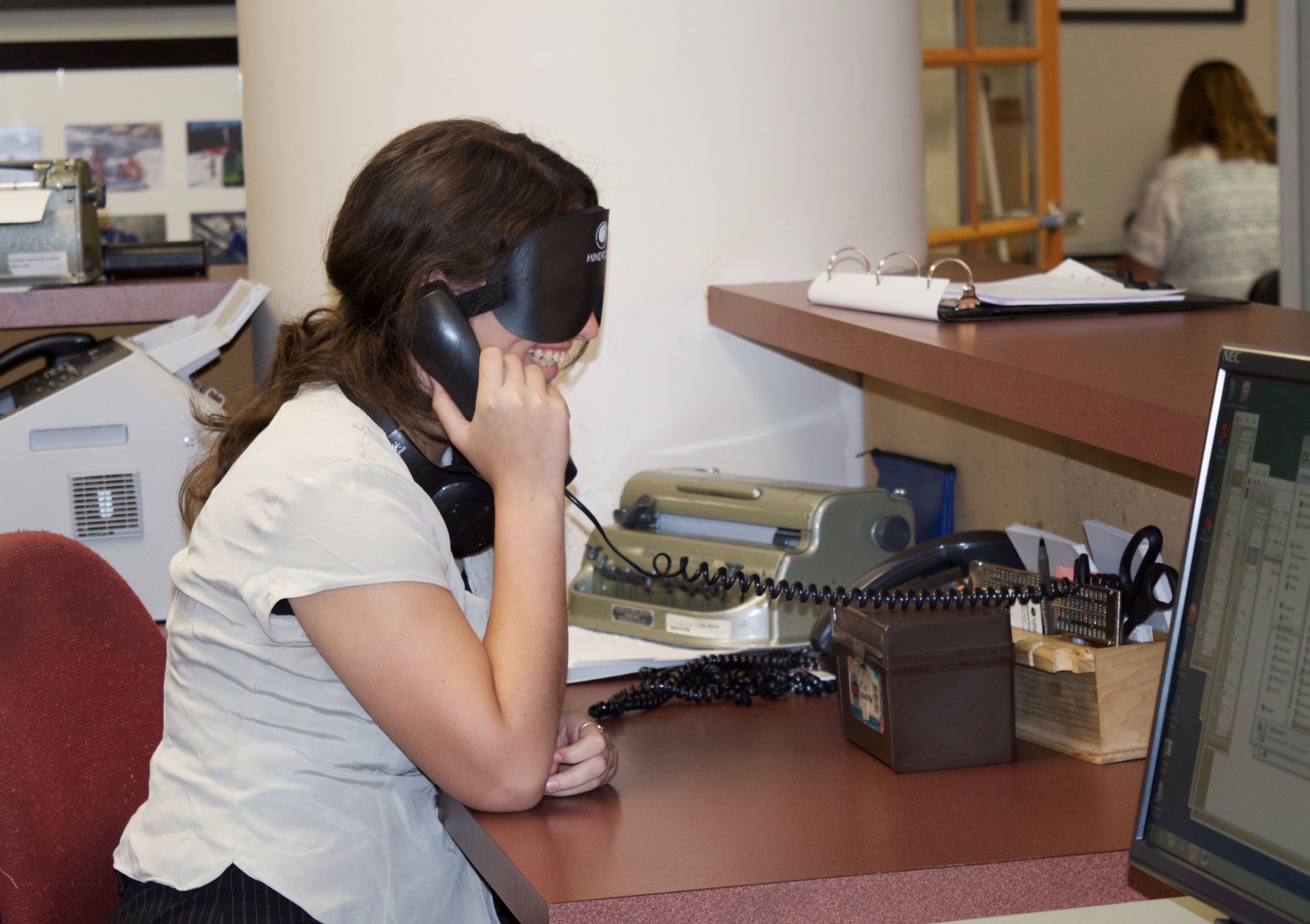Vanessa S. works the phone at the CCB Front Desk