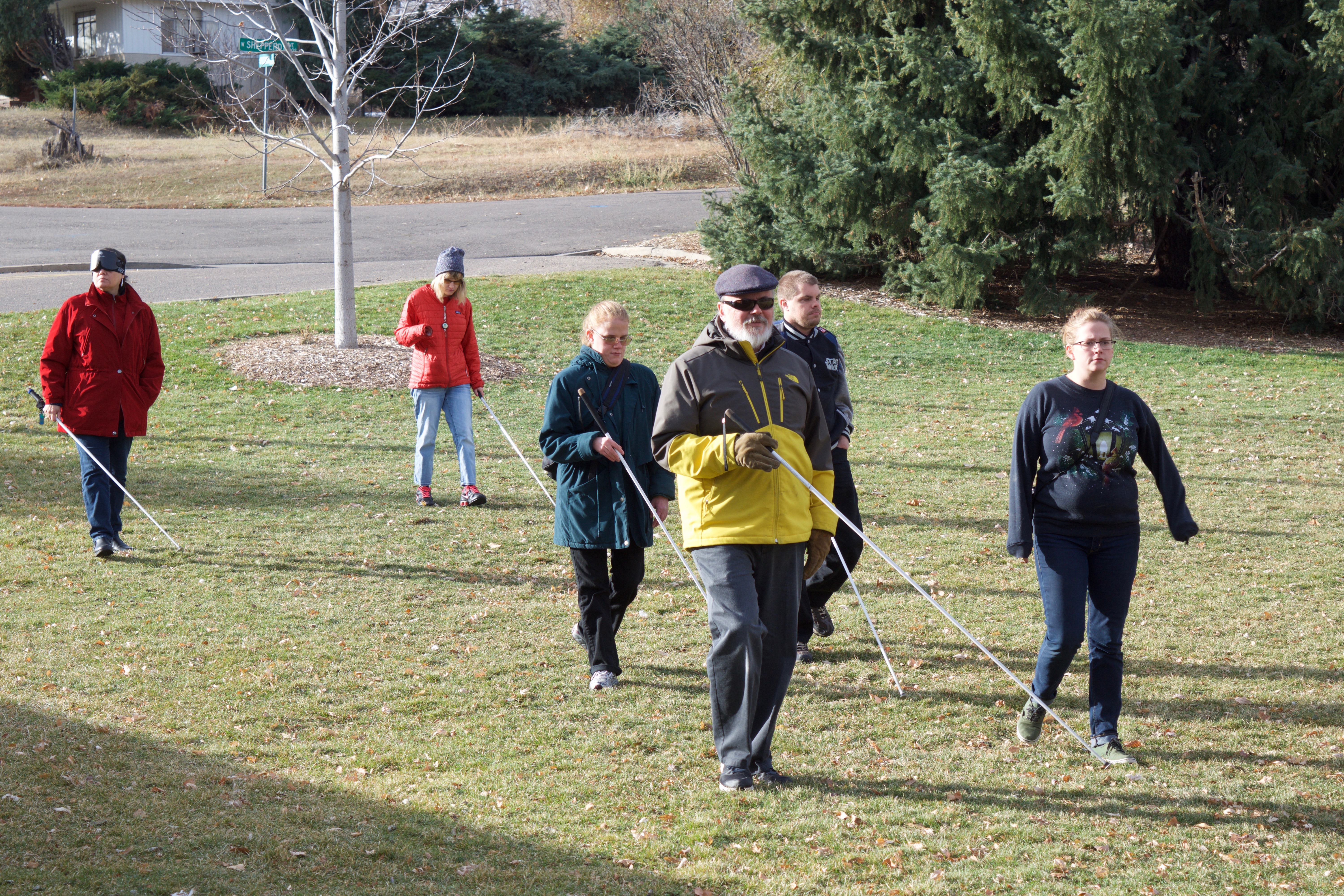 Alie with a CCB group walking across the park during Birding Class
