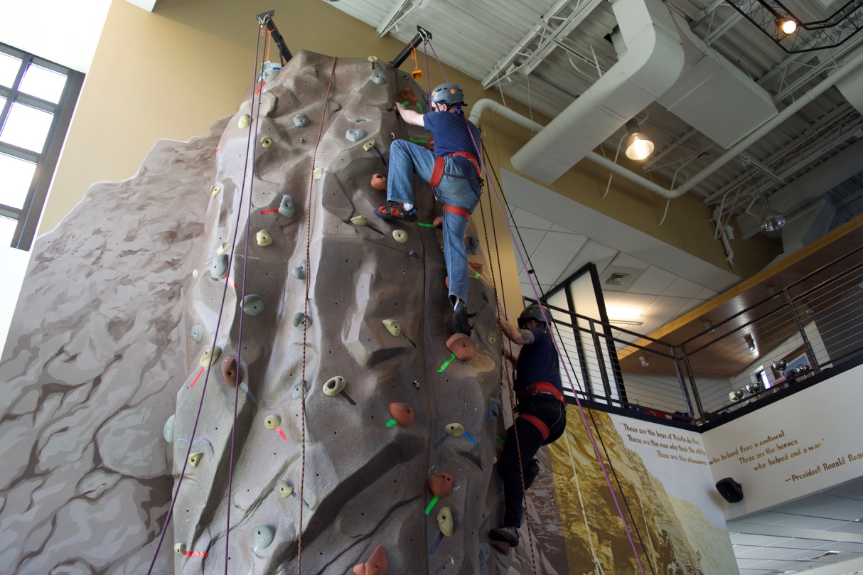 Ascending on neighboring routes, Dugan and Charles both near the top of the wall