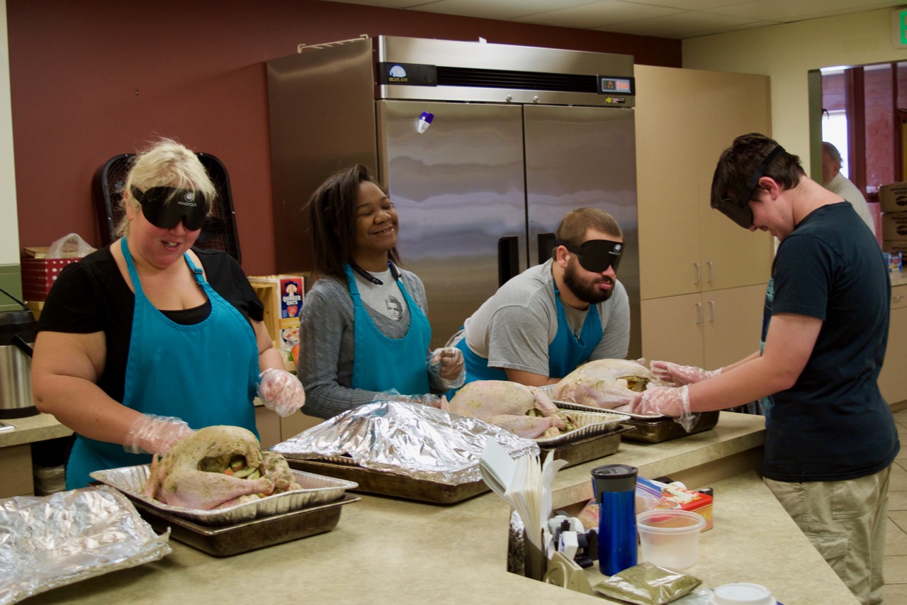 Lia, Ravi, Mason S. and Masson M. prepare four large turkeys to go into the ovens