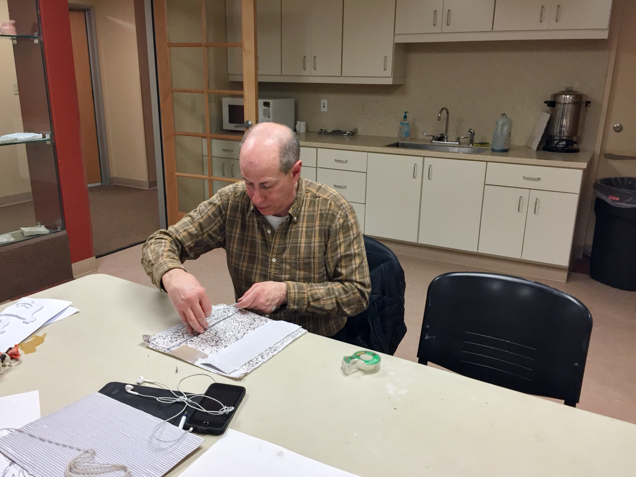 Peter experiments with textures on paper during a visit to art class this week.