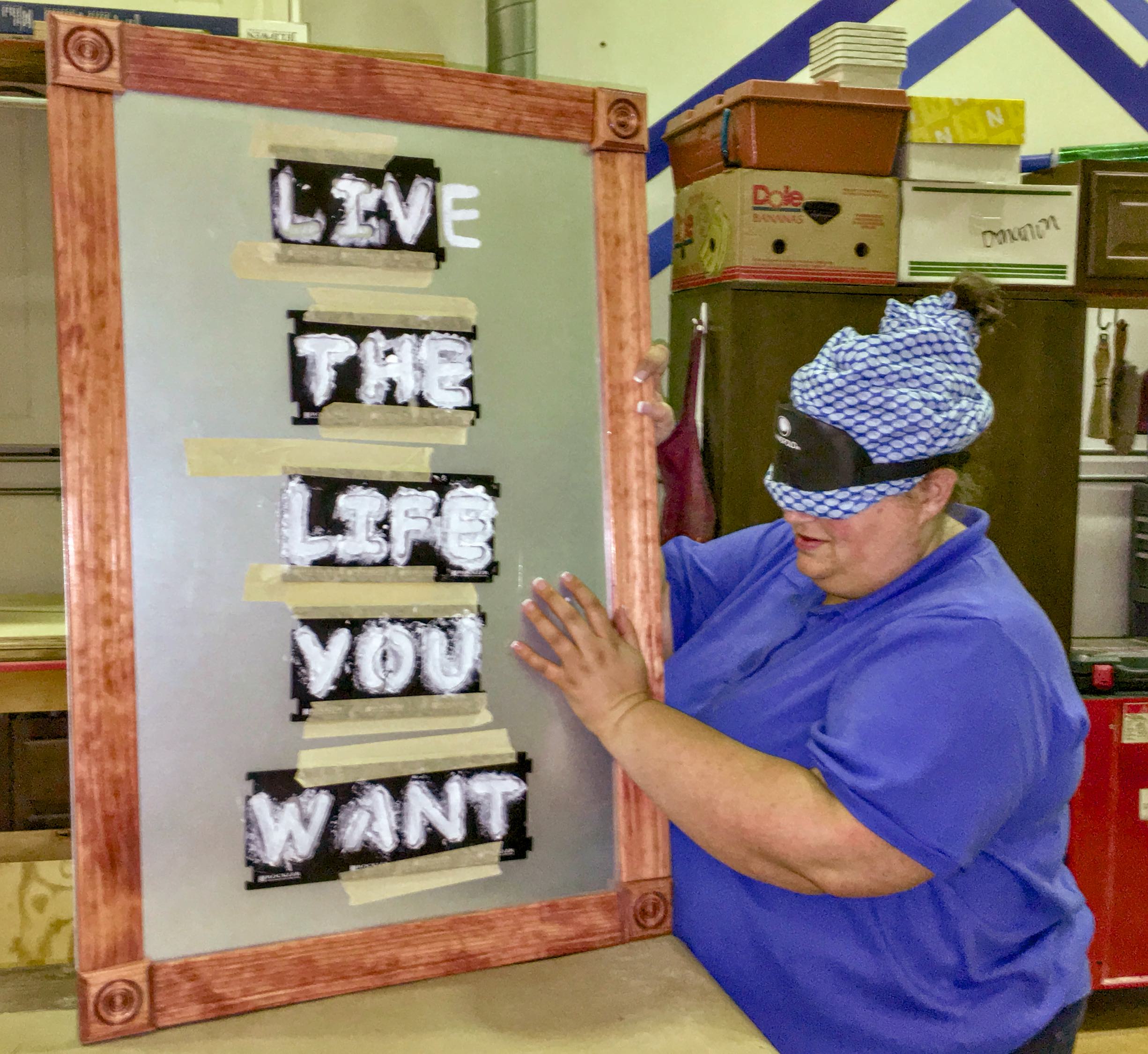 student showing lettering – Life the life you want!