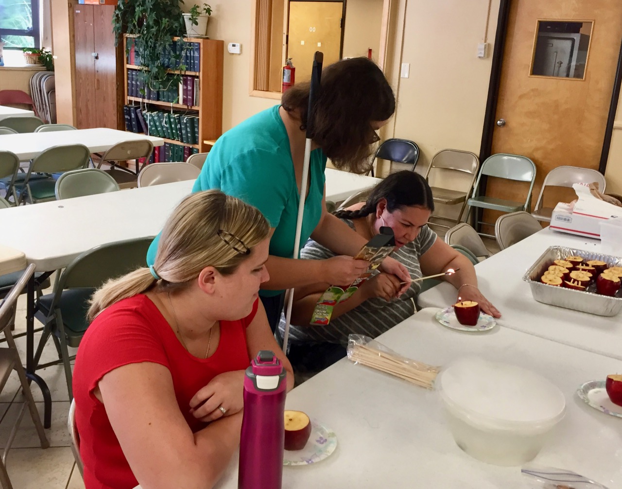 Ashley working with Keila on edible candle science project