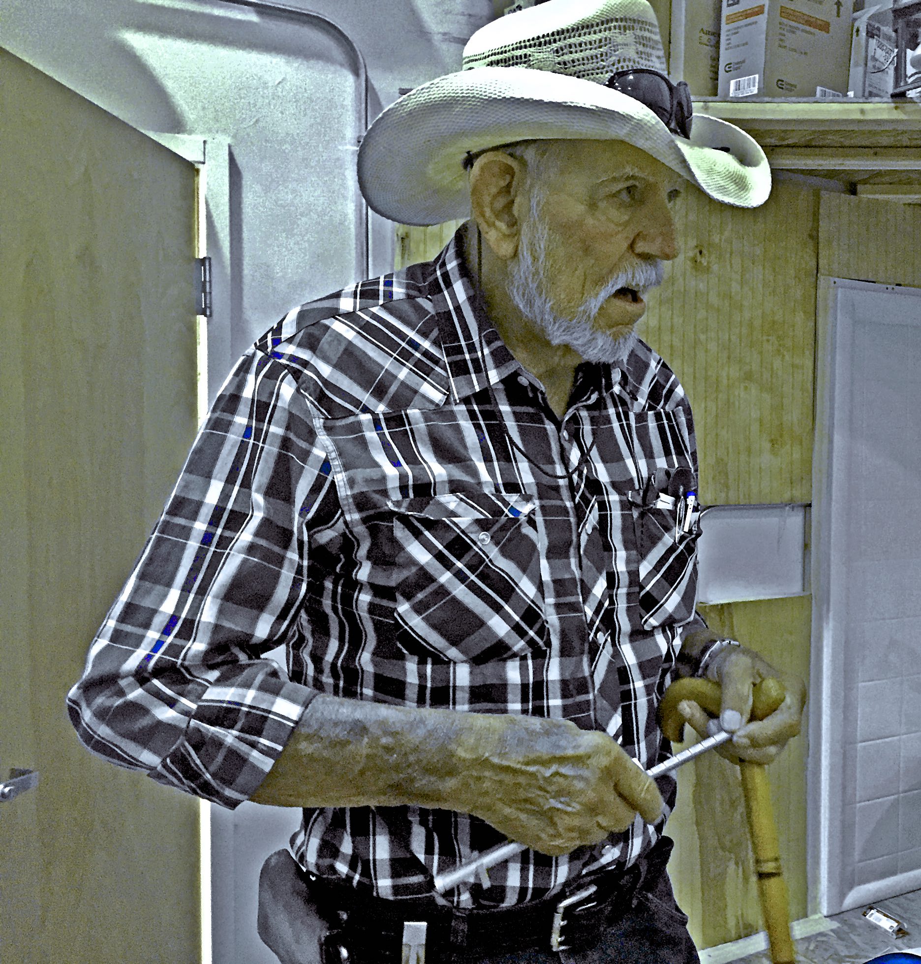 A man runs fingertips along a a notched aluminum tue