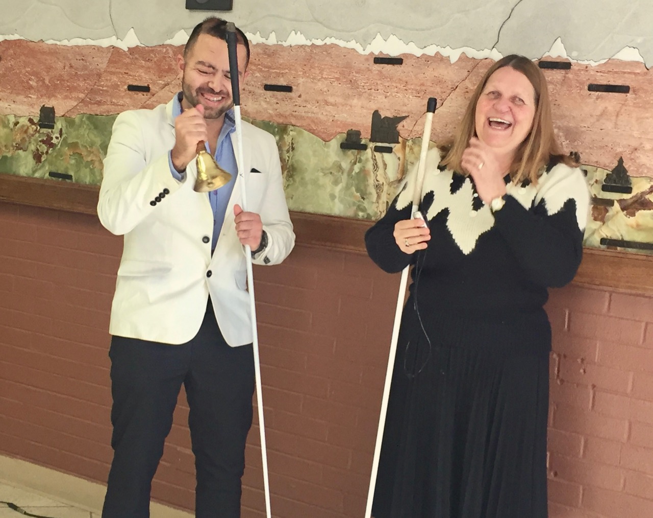 Cesar ringing his Freedom Bell and Julie clapping