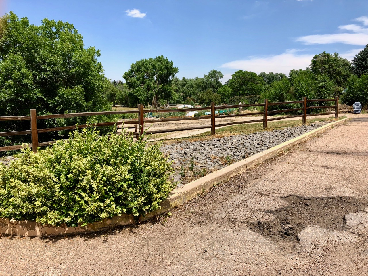Damaged pavement on the East side of the parking lot