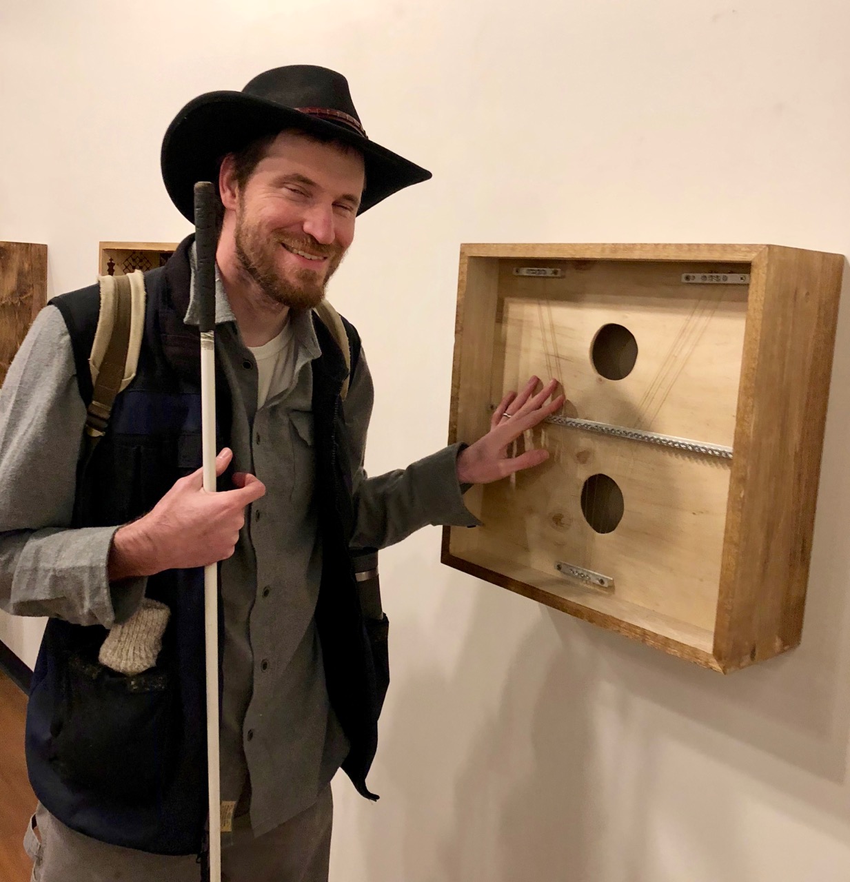 David looking at a box frame with tactile art