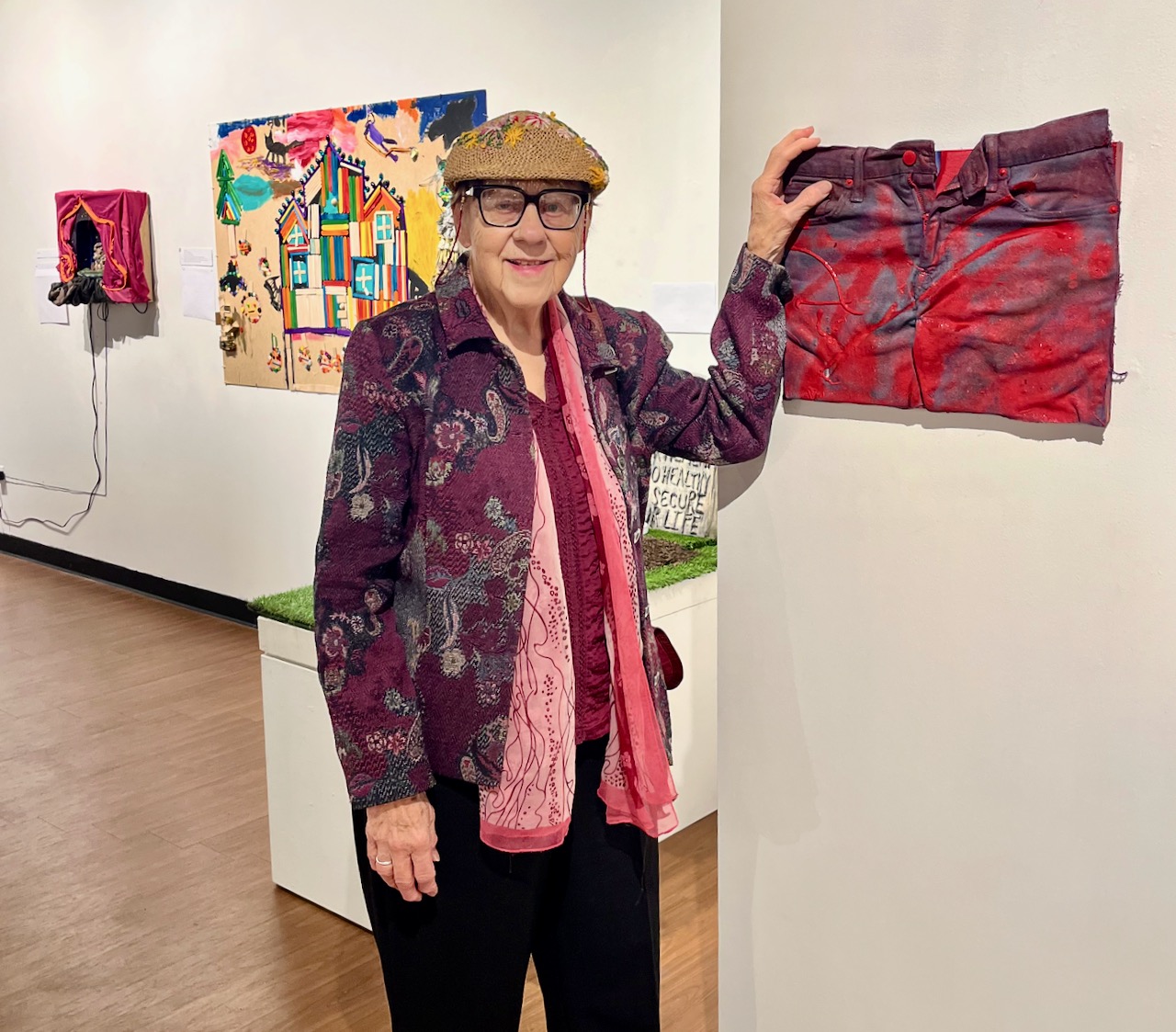 Freddie dressed colorfully for the trip to the art exhibit. Here she touches a piece titled “Frederick.”