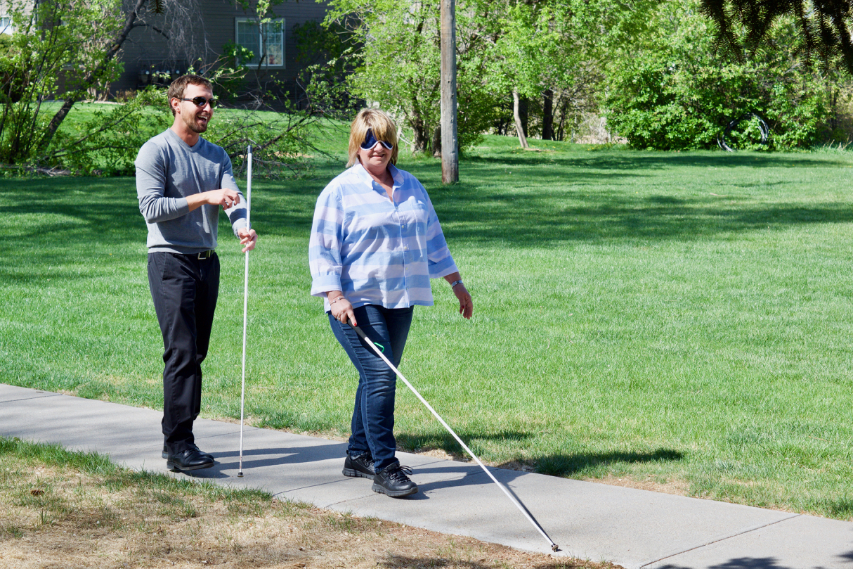 Holly and Petr returning to the Center after a Cane Travel lesson