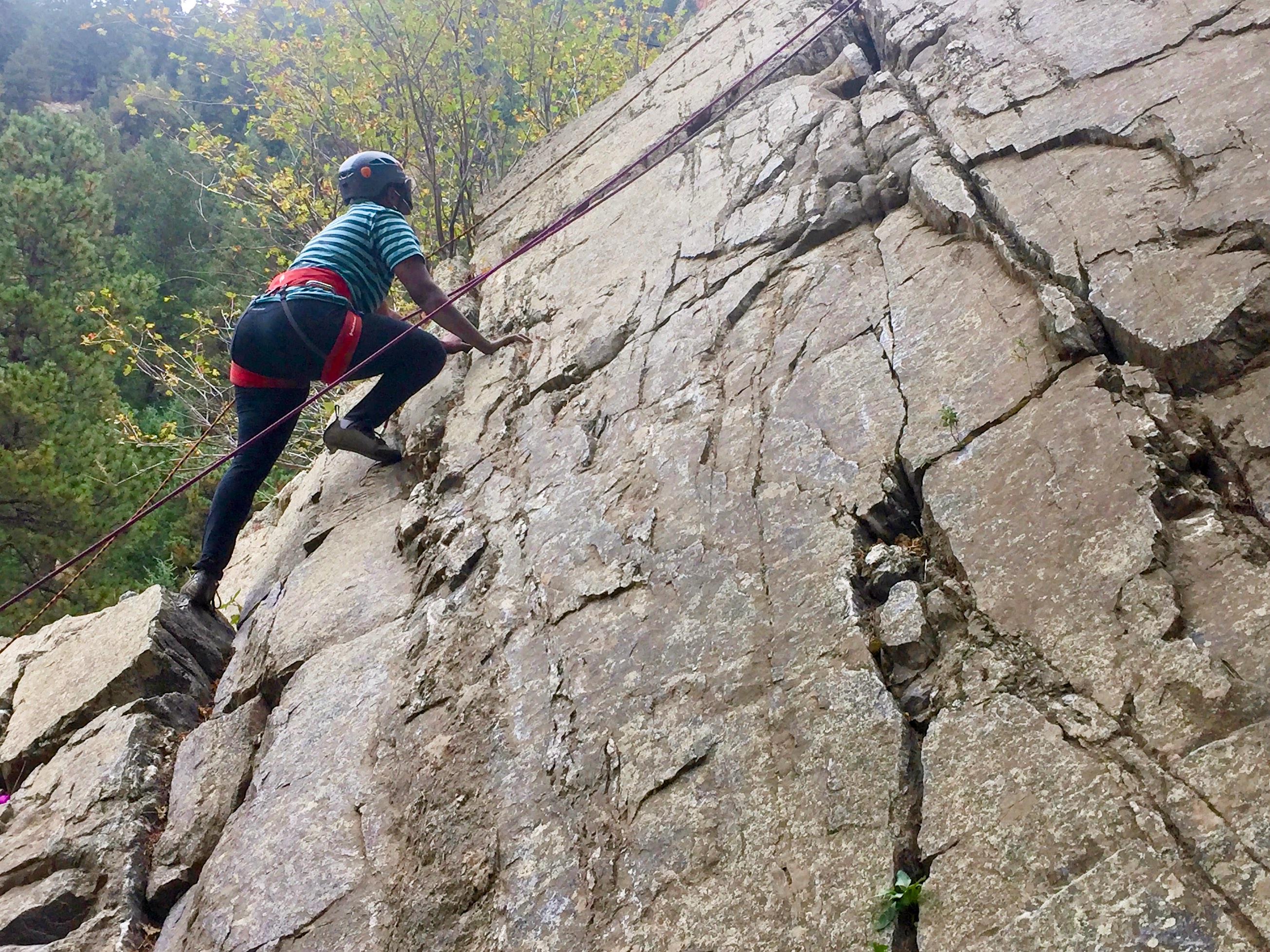 Christopher showing really good technique rock climbing