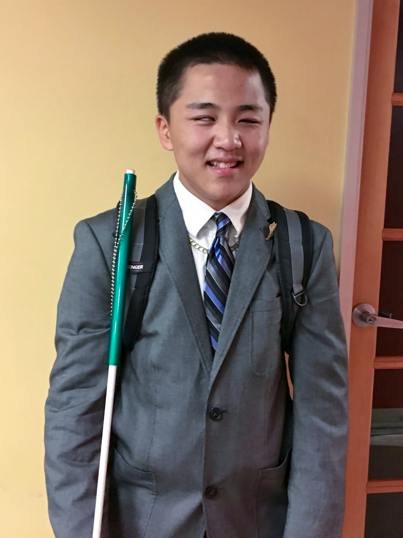 Isaac all dressed up in a jacket and tie for his Summer Employment position