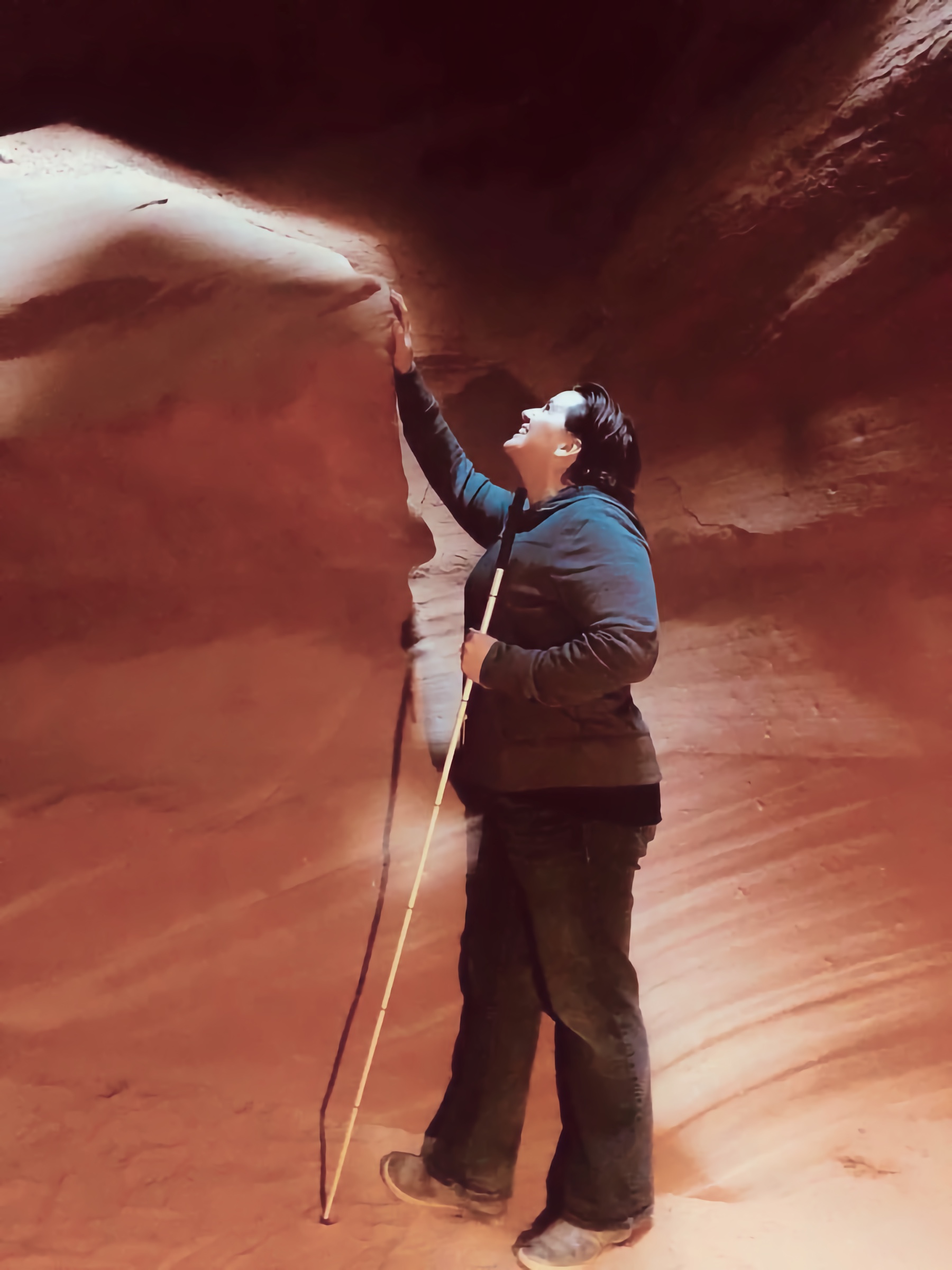 Libby with her cane exploring the wind and water whipped canyon walls at Antalope Canyon Arizona