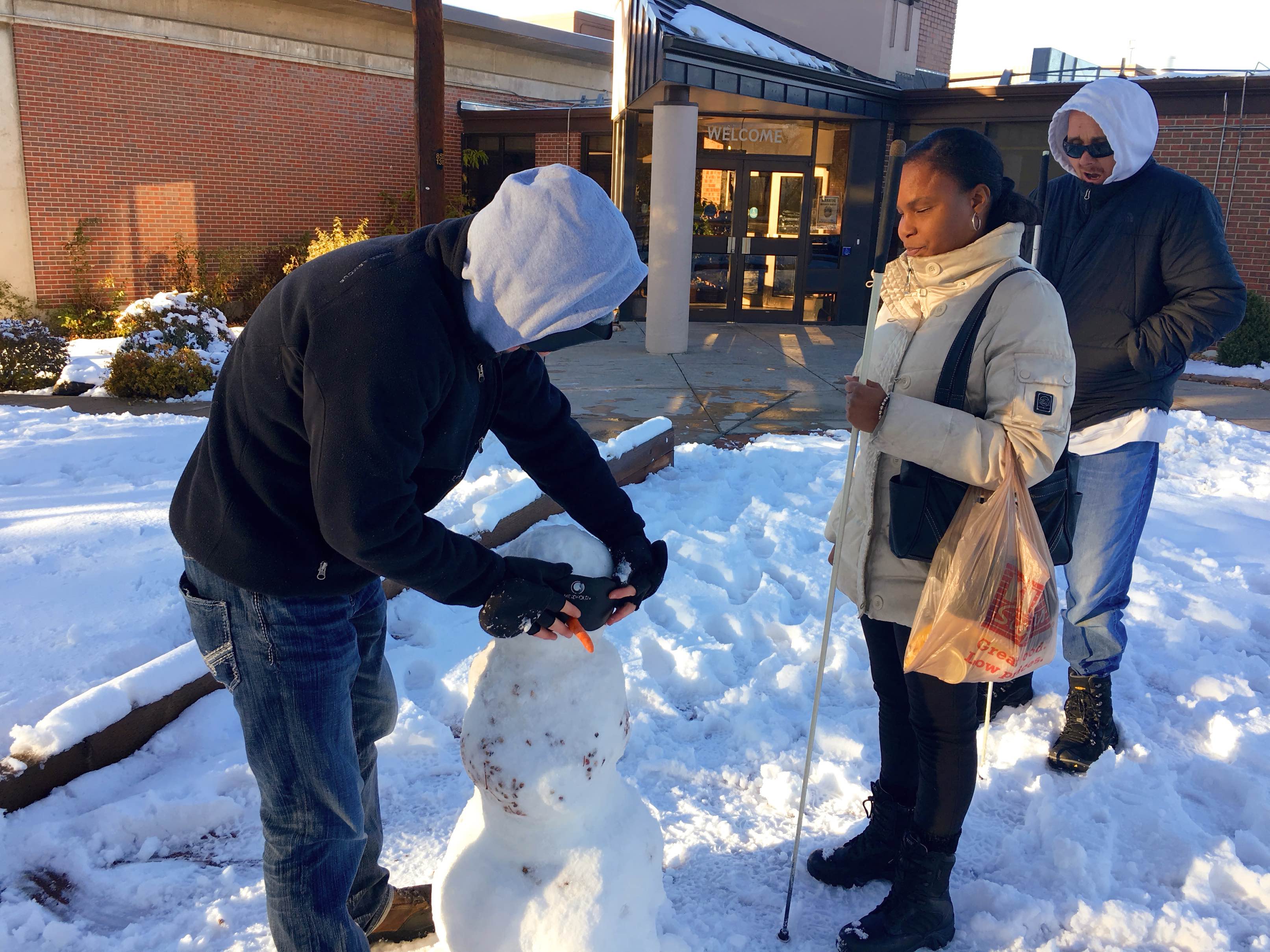 Marcus, Mo and James mentor their snow person that is indeed respectable to be blind.
