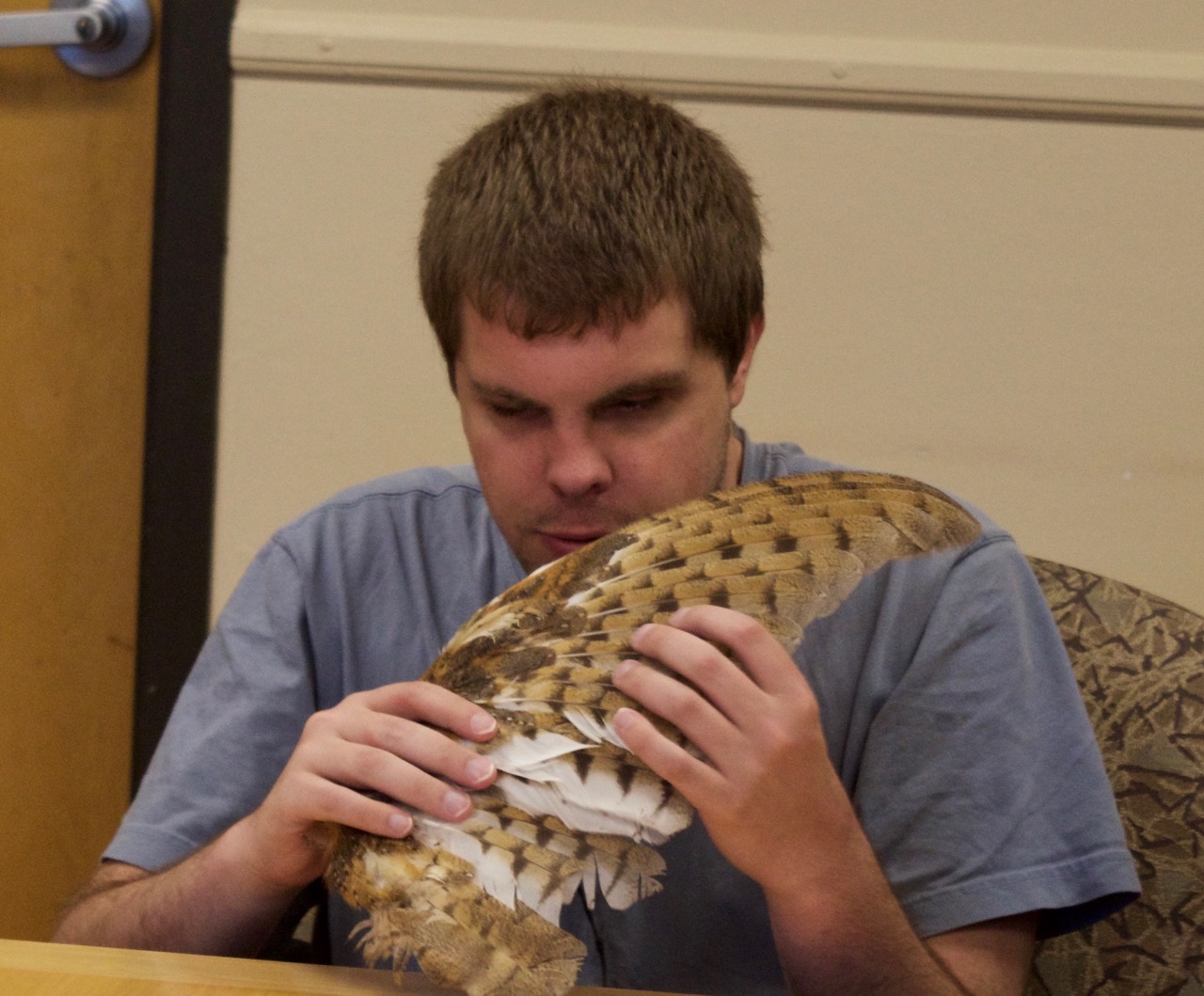 Mike looks at an Owl wing