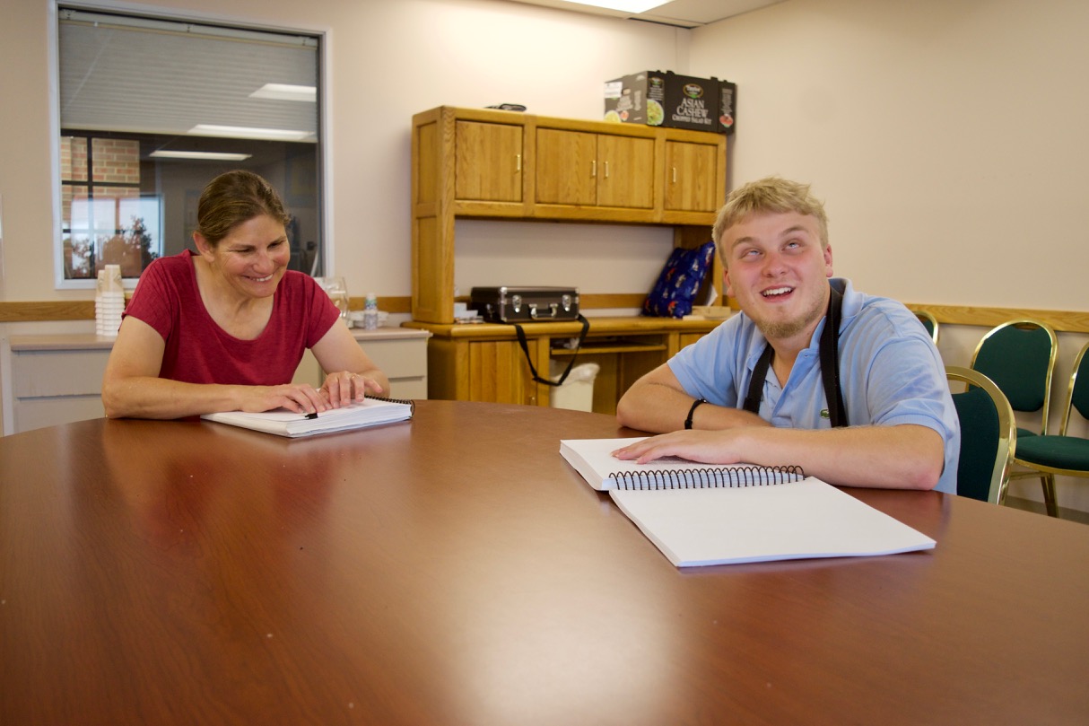 Nick teaches Susan how to read Braille in the Senior Program at the Colorado Center for the Blind