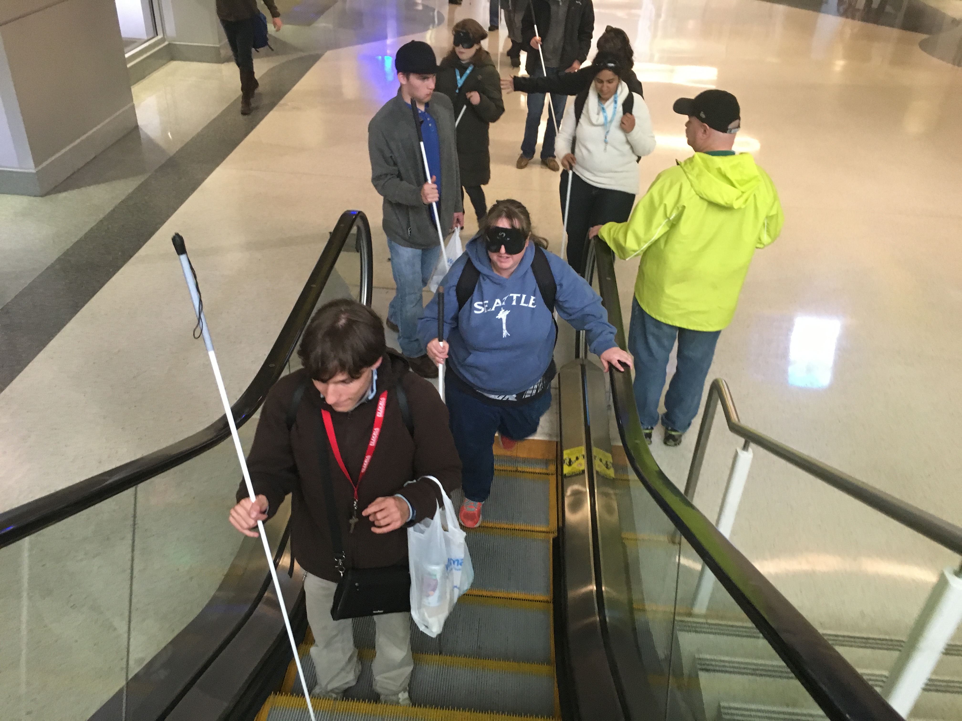 Richie, Chandler and a group of CCB students start up the escalator at Union Station