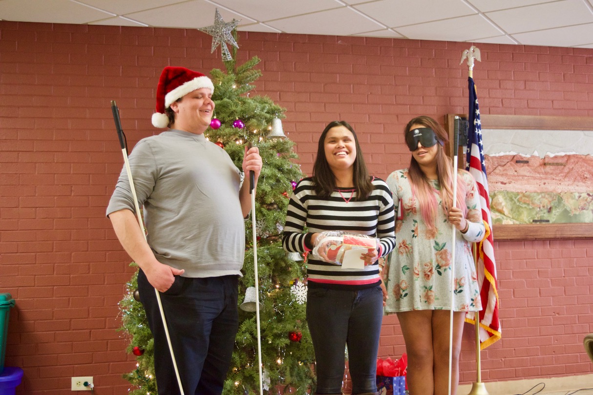 Stephannie B. opening her Secret Santa gift with Brett and Myra