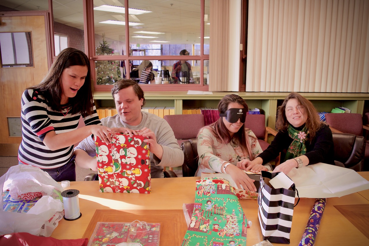 Stephannie, Brett, Myra and Delfina wrapping final gifts