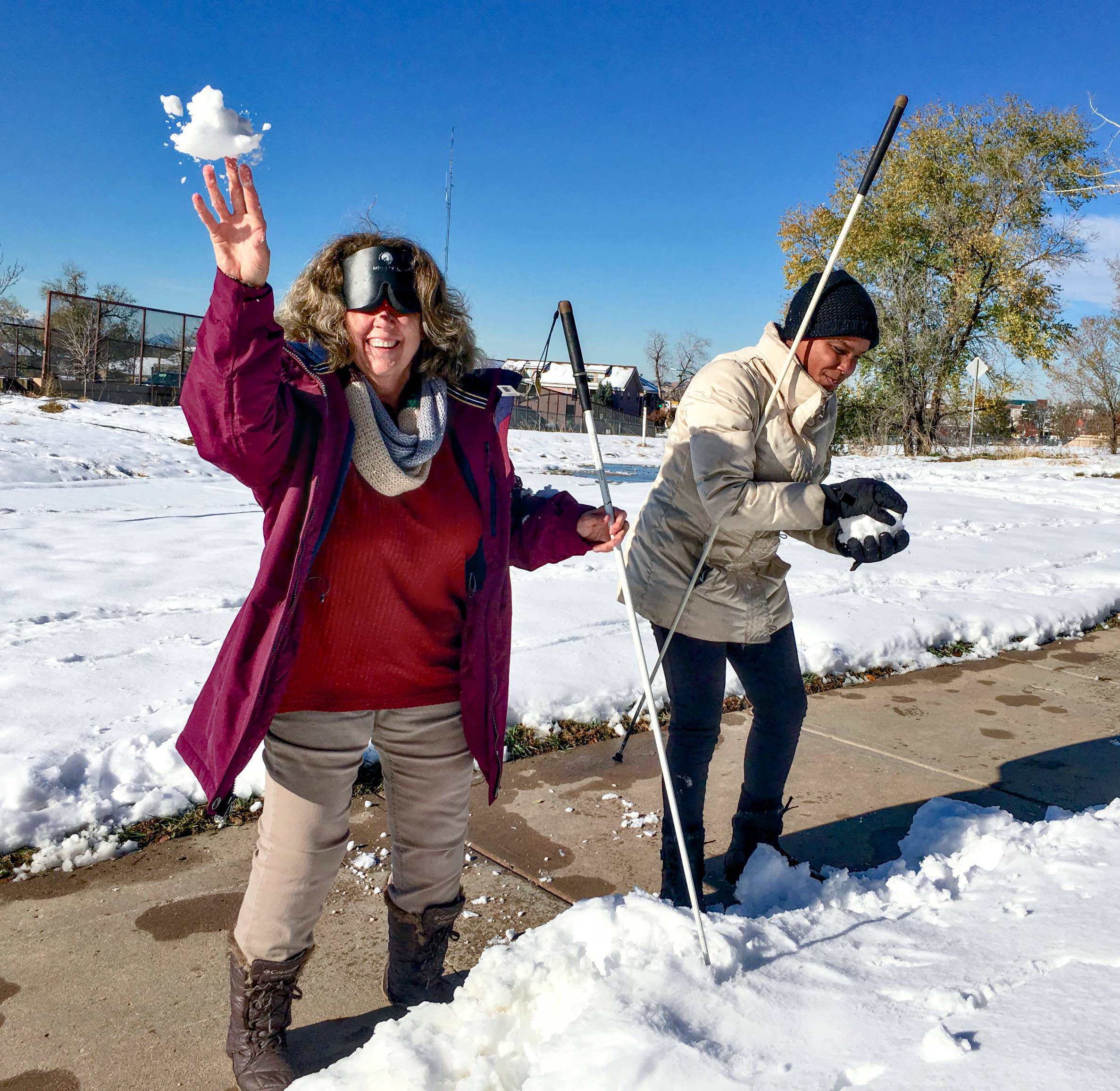 Vicki and Mo making and throwing snowballs A snowball is flying out of Vicki's hand right toward us