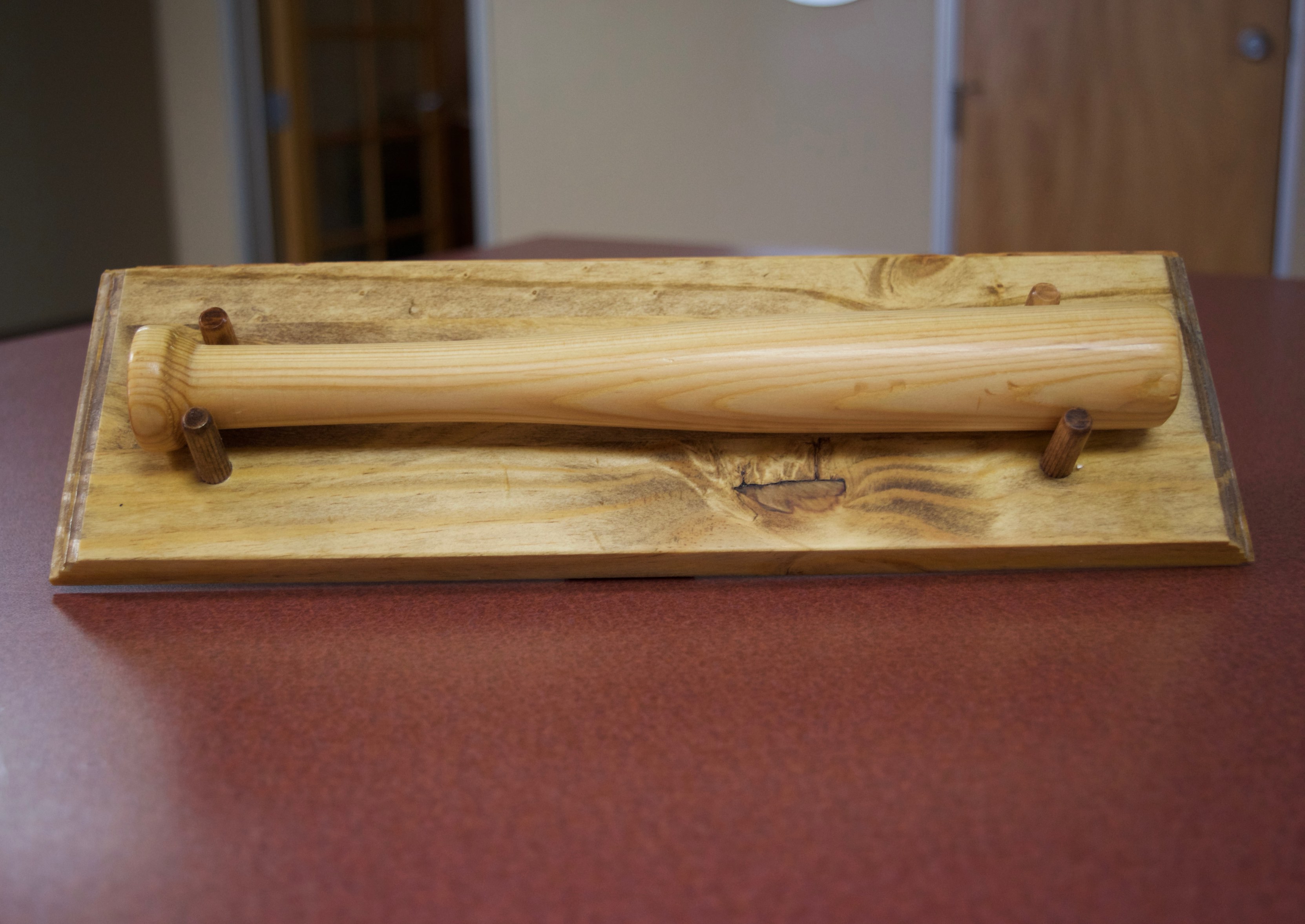 a miniature baseball bat with the CCB logo as trademark