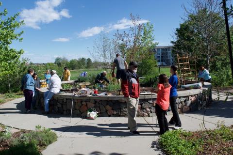 A large group working out in the garden