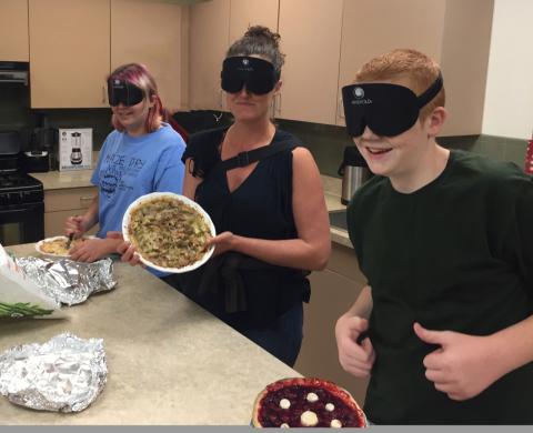 Adia, Melissa and Tyler (with 2 thumbs up) showing off their pies