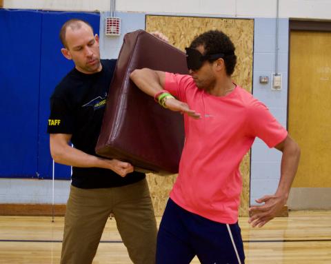 Chaz throwing elbow jabs at the pad in Martial Arts Class