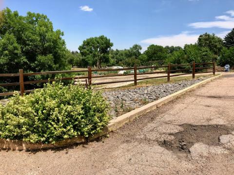 Damaged pavement on the East side of the parking lot