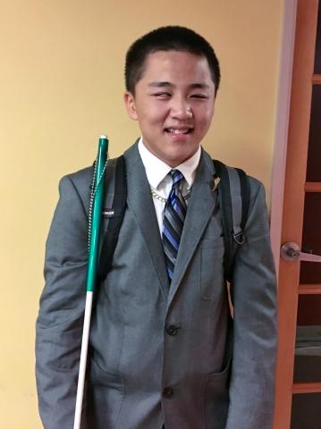 Isaac all dressed up in a jacket and tie for his Summer Employment position