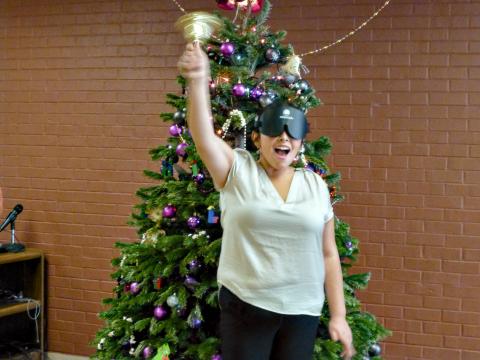 young woman rings her bell with a smile
