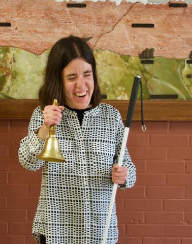 Serena ringing her Freedom Bell at her graduation