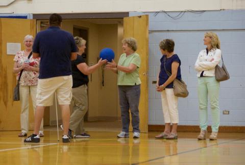 Two visitors test out the goal ball at our 2016 tour