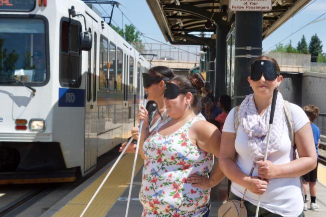 Amanda, Rocky and Christina at the Light Rail Station just as the train arrives