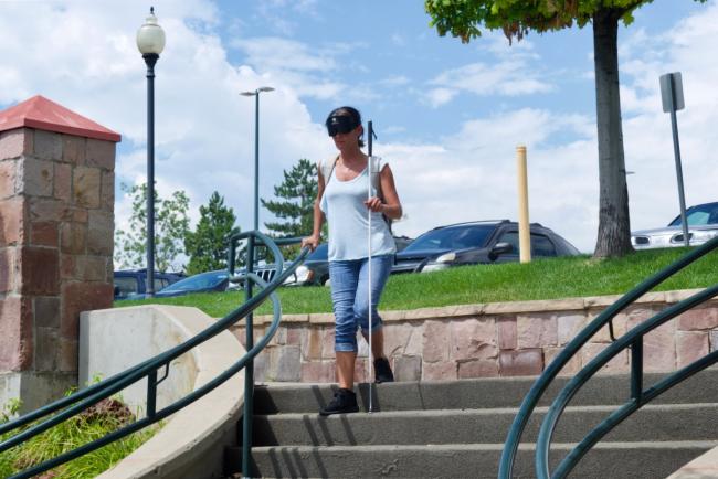 Amanda coming down the steps at the Light Rail Station