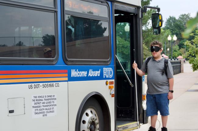 Andres gets ready to get on an RTD Bus