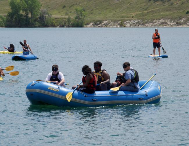 Students in a large raft