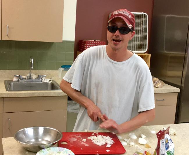 Jay in action chopping onions with attitude