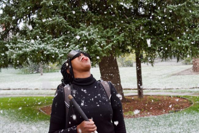 Loice in her first snow catching snowflakes on her toung