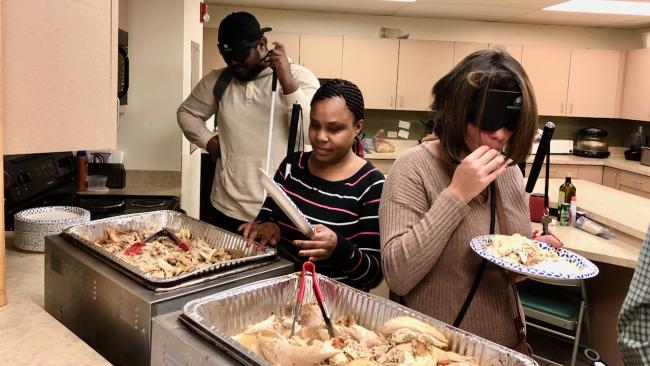 People filling Thanksgiving plates