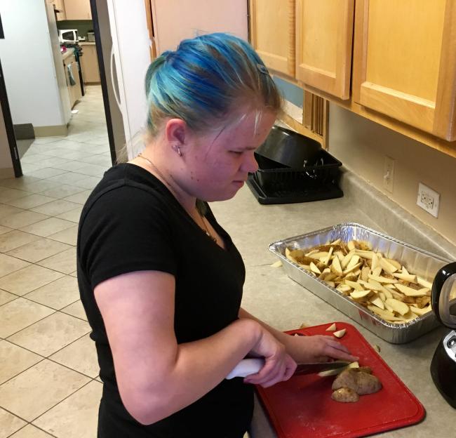Vika slicing potatoes