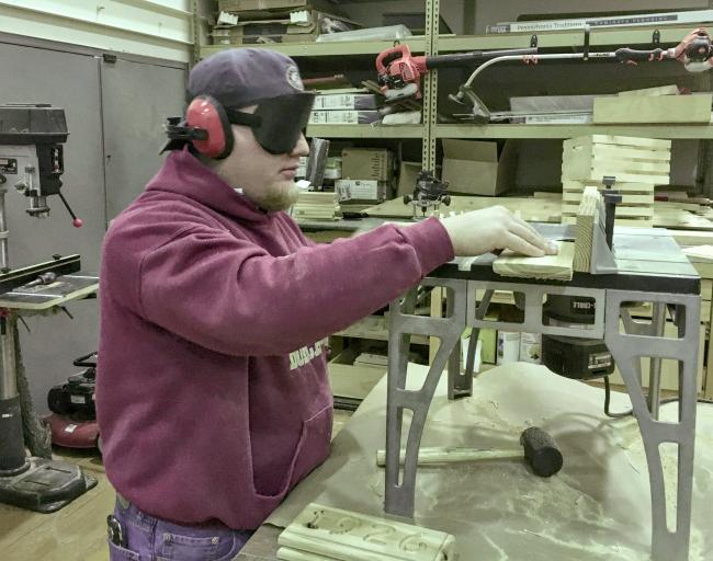 Daniel uses the router table