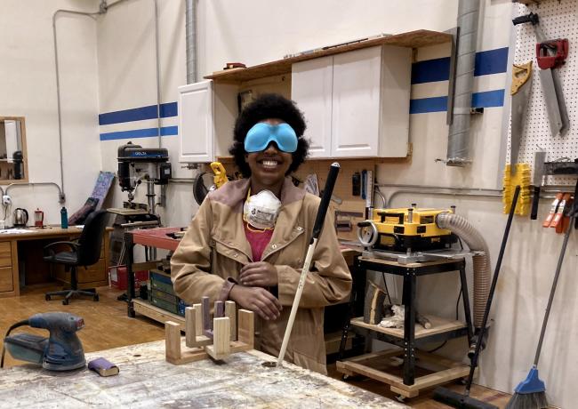 Bella Teta with her ingenious woodshop project