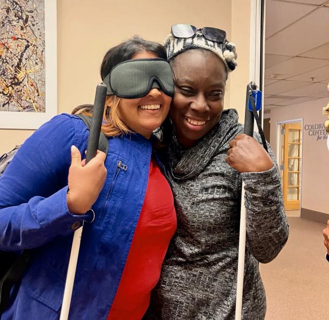 Bhavini and Nikki with arms around each other smiling, great friendships form at the Center